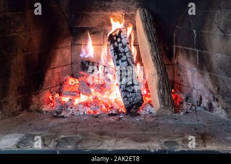 Burning and glowing pieces of wood in Fireplace Stock Photo - Alamy
