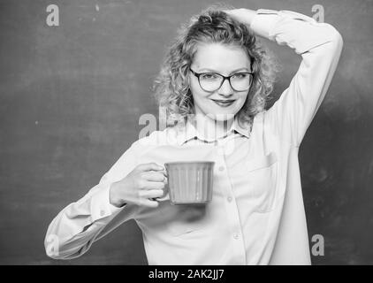 Morning inspiration. energy and vigor. energy charge. idea and inspiration. school teacher need coffee break. woman with coffee cup at blackboard. good morning. girl refreshing with tea drink. Stock Photo