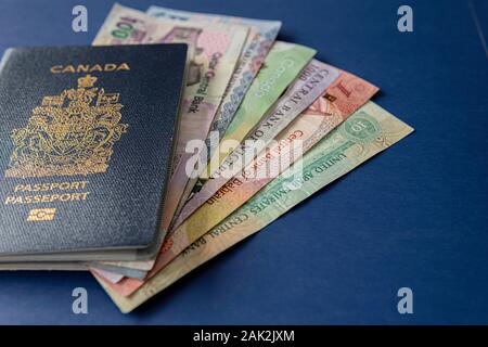 Canadian Passport with various currencies Stock Photo