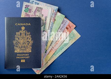 Canadian Passport with various currencies Stock Photo