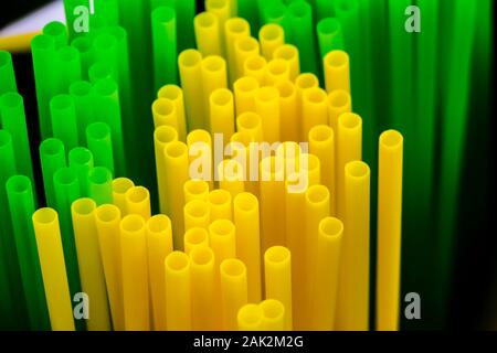 Many colored plastic tubes for drinks close-up. Stock Photo