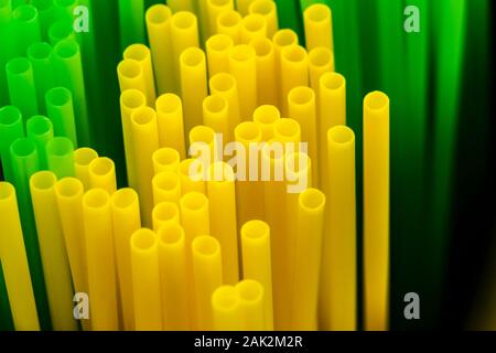 Many colored plastic tubes for drinks close-up. Stock Photo