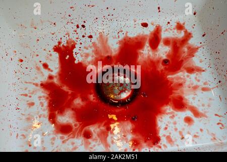 Many blood dripping into the washbasin in the bathroom, bloody and  sink Stock Photo