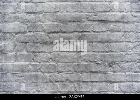 Old brick painted wall. The brick wall is black and white. Stock Photo