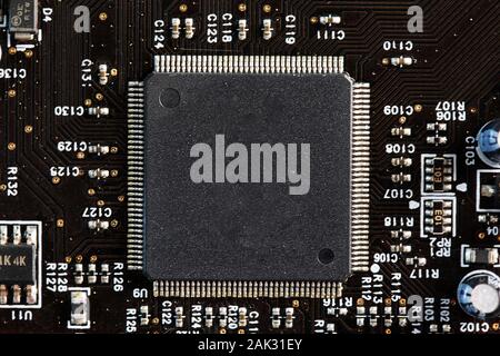 PC microchip. Selected focus. Integrated semiconductor microprocessor on circuit board representative of computer technology science. Stock Photo