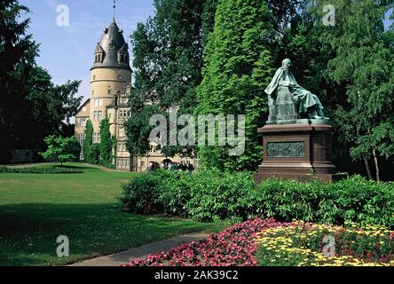 A gorgeous park surrounds the princely Residence Palace Detmold in Detmold. In the park stands a monument of the Earl Ernst zu Lippe. Until 1918 Detmo Stock Photo