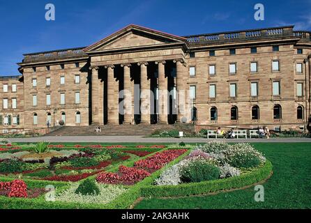 Colorful flowerbeds are situated in front of the garden facade of the Baroque Wilhelmshöhe Palace in Kassel. The palace was built between 1786 and 179 Stock Photo