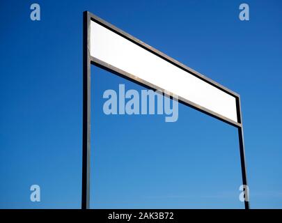 Blank rectangular signboard on blue sky background. Stock Photo