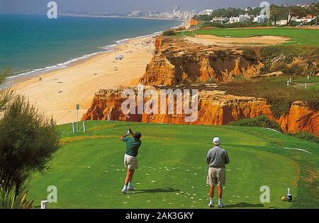 Two golfers on the Royal Golf Course in Vale de Lobo, Algarve. The miles long sandy beach can be seen in the background. (undated picture) | usage wor Stock Photo