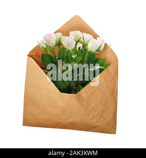 Opened craft paper envelope with white rose flowers isolated on white background Stock Photo