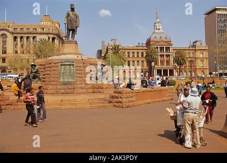 A bronze statue of Paul Kruger whom you can see on this photo stands at the Church Square in Pretoria, South Africa. Paul Kruger was president of the Stock Photo