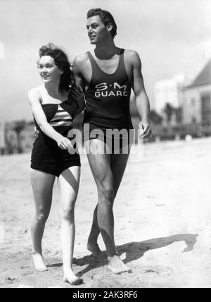 JOHNNY WEISSMULLER and MAUREEN O'SULLIVAN 1933 publicity photo on Santa Monica Beach California Metro Goldwyn Mayer Publicity Stock Photo