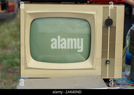 An old-fashioned analog TV in gray with a kinescope.Retro electronics Stock Photo