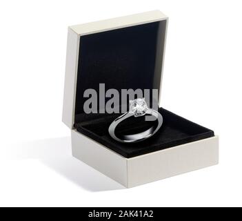 Diamond and white gold or platinum ring displayed in a jewellery box on black velvet as a gift for a loved one, engagement or fashion accessory Stock Photo
