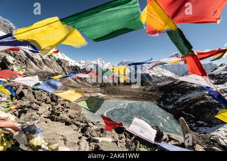 Heart shaped frozen lake from the top of the Kongma La pass in the Khumbu in the Himalaya in the Chukung valley in Nepal on a sunny winter day Stock Photo