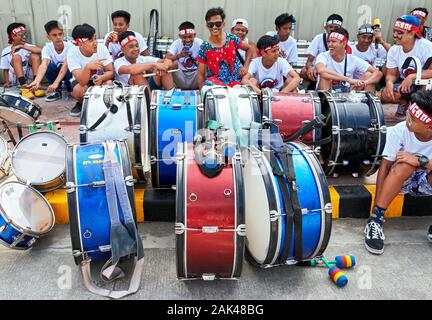 Ibajay Town, Aklan Province, Philippines - January 27, 2019: Group of drummer boys having a break after the parade at the Ati-Atihan Festifval Stock Photo