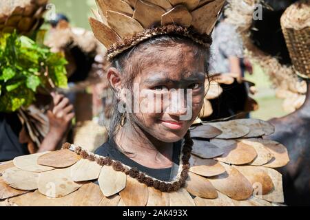 Ibajay Town, Aklan Province, Philippines - January 27, 2019: Portrait of teenage girl in native costume joining the parade at the Ati-Atihan Festival Stock Photo