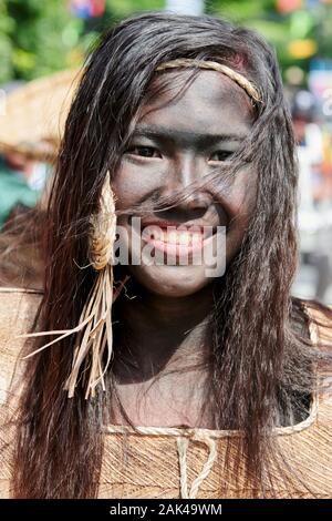 Ibajay Town, Aklan Province, Philippines - January 27, 2019: Portrait of a teenage girl joining the street dancing parade at the Ati-Atihan Festival Stock Photo