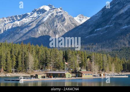 Lake Minnewanka, a glacial lake in the eastern area of Banff National Park, Canada with the snow-capped Canadian Rockies in the background Stock Photo