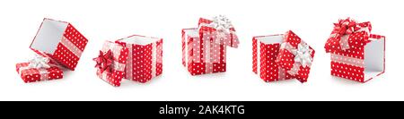 Red gift boxes with white dots and ribbon bow creative collection isolated on white background. Holiday present. Design elements, composition banner Stock Photo