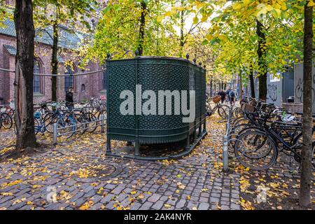 Decorative public toilets & autumn foliage on Nicolaj Plads, Copenhagen. Stock Photo