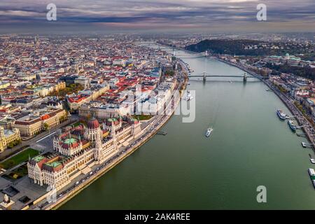Budapest, Hungary - Aerial drone view of the beautiful Hungarian Parliament building at sunset with St. Stephen's Basilica, Szechenyi Chain Bridge, si Stock Photo