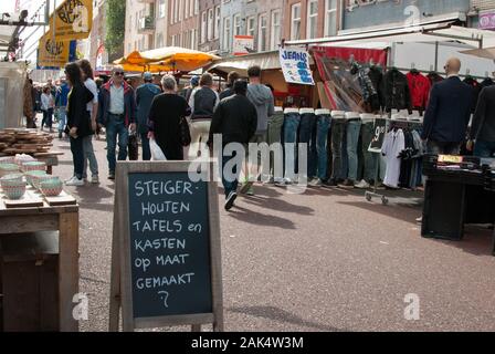 Peolple walking through street market and shopping Stock Photo