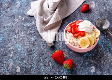 Oatmeal with strawberry, banana and ice cream Stock Photo - Alamy