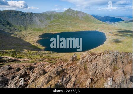 Red Tarn below Catstye Cam viewed from Striding Edge on Helvellyn in the English Lake District Stock Photo