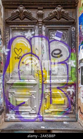 entrance door covered by graffit at the Schanzenviertel in Hamburg, Germany Stock Photo