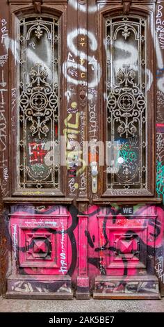 entrance door covered by graffit at the Schanzenviertel in Hamburg, Germany Stock Photo