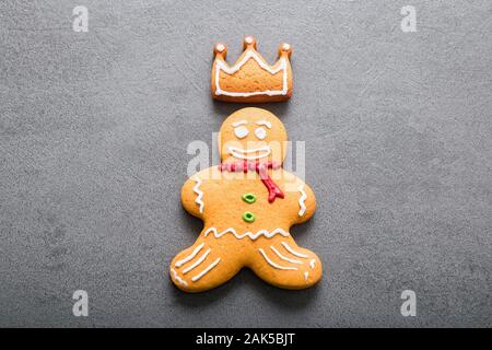 Christmas homemade gingerbread man on dark background. Stock Photo
