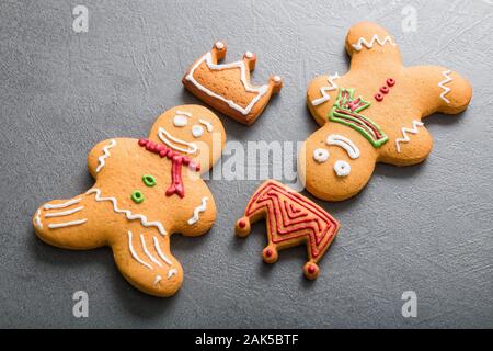 Christmas homemade gingerbread man on dark background. Stock Photo