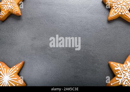 Christmas homemade gingerbread cookies on dark background. Stock Photo