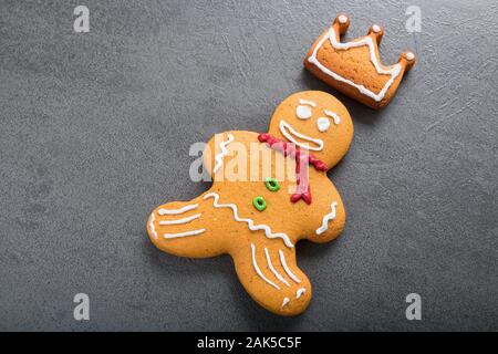 Christmas homemade gingerbread man on dark background. Stock Photo