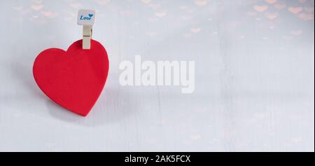 Red hearts set on string over white background. Valentine's day concept. Space for text Stock Photo