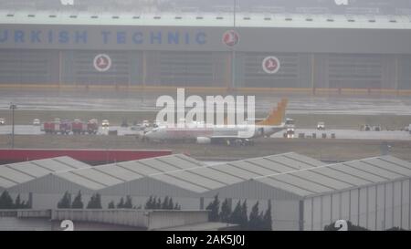 (200107) -- ISTANBUL, Jan. 7, 2020 (Xinhua) -- Photo taken on Jan. 7, 2019 shows a passenger plane which skidded off the runway after landing at Sabiha Gokcen International Airport in Istanbul, Turkey. A Boeing 737 airplane with Turkey's Pegasus Airlines slid off the runway at 09:05 local time after arriving from Sharjah International Airport in the United Arab Emirates, according to the Sabah daily. No injuries were reported. (Ihlas News Agency/Handout via Xinhua) Stock Photo