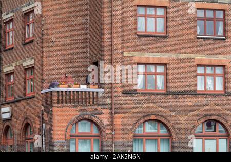 a house facade with balcony at the edge seen in Hamburg Stock Photo - Alamy