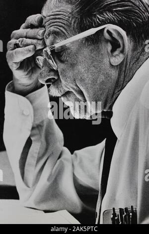 Fine 1970s black and white vintage photography of an older man furrowing his brow and reading something Stock Photo