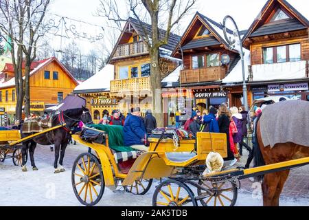 Zakopane, Poland - January 2, 2019: People walking at Krupowki street in Zakopane Stock Photo