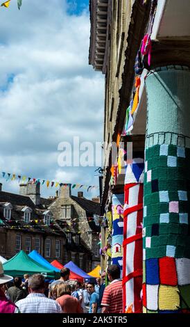 Yarn bombed buildings in Oundle, Northamptonshire on the day of a Summer Fayre Stock Photo