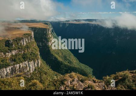 Fortaleza Canyon shaped by steep rocky cliffs with forest and flat plateau near Cambara do Sul. A town with natural tourist sights in southern Brazil. Stock Photo