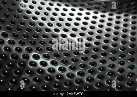 A close up of the surface of the inside of a washing machine Stock Photo