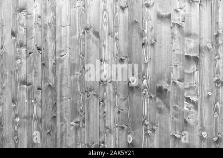 Dark brown and white reclaimed wood surface with aged boards lined up. Wooden painted planks on a wall or floor with grain and texture. Neutral flat v Stock Photo