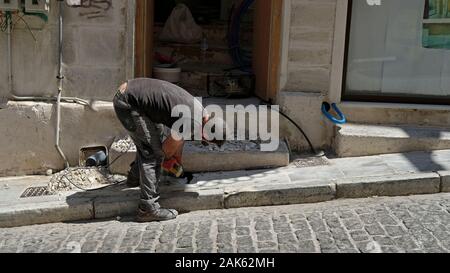 A builder at work in Greece. Stock Photo