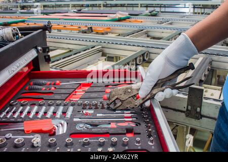 The set of hand tools for to repair. Many wrench and tools close-up in box for to repair the conveyor and car or replace automotive spare parts, auto Stock Photo