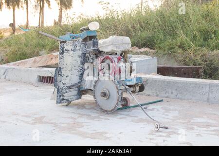 The joint cutter machine on a brushed concrete surface. Construction equipment for cutting saw slab. Stock Photo