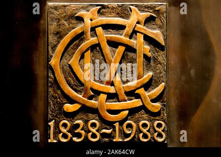 MCC Melbourne Cricket Club insignia on 150th 1838-1988 commemorative bronze doors at MCG - Melbourne Cricket Ground Stock Photo