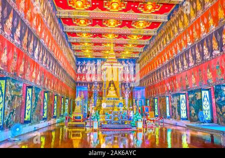 BANGKOK, THAILAND - APRIL 15, 2019: The interior of Phuttaisawan Royal Hall with golden Buddha and amazing frescoes on the walls and the ceiling, depi