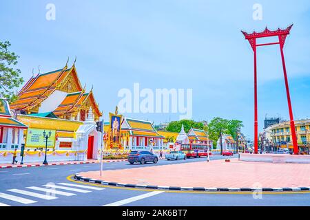 BANGKOK, THAILAND - APRIL 15, 2019: The Wat Suthat temple and the Giant Wing structureaare the most famous landmarks of historical residential part of Stock Photo